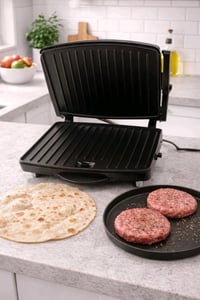 كابسة كهربائية للشواء، مناسبة لتحضير البرجر والساندويشات بشكل مثالي. ا...