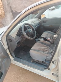 كيا اوبتيما خليجي موديل 2005 رقم بابل انكليزي بأسمي السعر ٥٥ وبيها مجا...