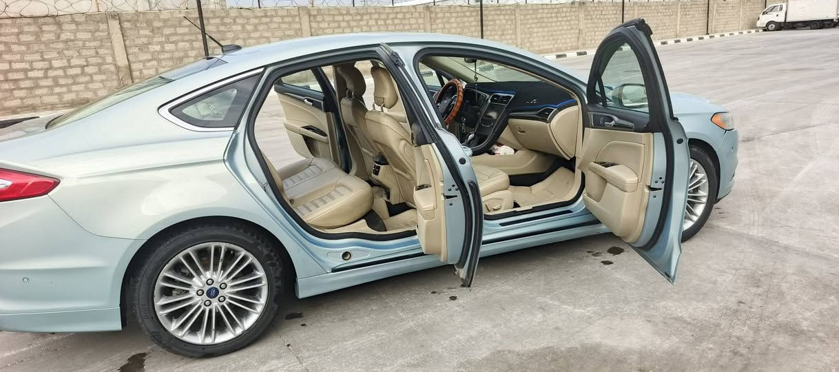 {بسم الله الرحمن الرحيم}
فورد فيوجن هايبرد se
2.0L 
موديل 2013
(معلايه 2022)
م.اي اشكال شرعي ما بيها (شرط التحويل)

مواصفات ...
لون مميز (ازرق سمائي)
فووول معروفه
داخل بيجي كلش نضيف
رادار 📹
تحكم سترين😎
ويل 18 
اشاير بالمري ⏩⏪
تبريد قطعتين 🥶🥶ثلج
مقاعد تدفئه 
مقاعد جلد بيجي 
شاشه كبيره S2
سستم صوت SONY
كامره خلفيه📸 
رمز دخول بالباب 🔢 
دبل سويج 🔑🔑
مواصفات هواي حلوه .....

الم ..
حادثها سرقه گير بامريكا 
بارد قطعتين باب السايق 
وجاملق عكس امامي
وكم رصعه اثر الحصو المتطاير 
مرجعات بارد ممبينات اصلا 

محرك وگير ومنضومه هايبرد 
كفاله عامه( بشرط )
بانزين( عادي )لا دوانز ولا قلت سحب 
ممشاها (270 الف) كم قابل للزياده

السياره بسمي رقم انگليزي 
وكامله من كلشي نقص برغي ما بيها
 صدر جديد تخم تاير جديد 
( السياره للجناي ) 
تراي وين ميعجبك 💪💪 
مكان السياره بغداد اليوسفيه 
السعر 115 $ وبيها مجال بسيط 

*********** واتساب
