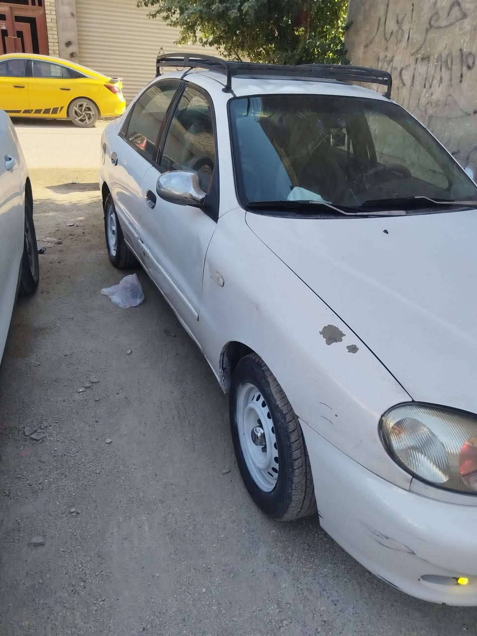 للمراوس بلكنزا
دايو لانوس محرك مفتوح 1600 موديل 2000
تفاصيل السياره
🫕  مكفولة من الصبغ
بيها طخات بسيطةو خياس بالباب الهلفي فقط 
🛞 تخم ويل 14 + تايرات جدد ماركة موهاكو
🪫 باتري جديد 74 امبير
❄️ تبريد ثلج
🔥 تدفئة شغاله.
صدر امامي خلفي منفوض
بطاين بوب. بعدهن بالجيس
4 جام كهربائي
السياره مغلفه داخل  عازل حراري
محرك و كير شرط الفحص بيها كير اوبترا يشك الكاع
4 سماعات و مسجل قابل للتزويد بدمام
كهربائيات كلها شغاله
سنوية باسمي  مكاني بغداد الدورة ***********
