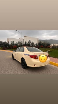 سلاو کرۆلا بیلادتەکسی مۆدیل٢٠١٠ گیرومەکینەی بەشەرت کارەبایی و تەبرید ب...