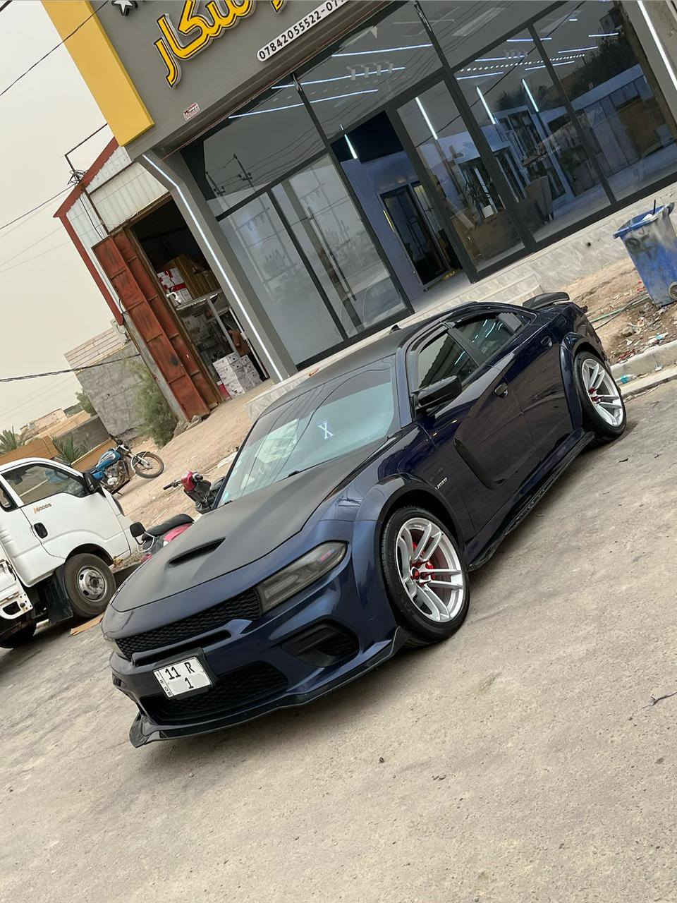 سلام عليكم السعر مناسب سياره  عليه نصبه كلش حلوه السعر  (((168))) سياره فول مواصفات عده فتحه  من رخصه الادمن البيع / دودج جارجر R/T موديل 16 اصل اصل رقم بغداد دولي مشروع وطني سنويه ل 30 السياره محدثه وايد بدي اصلي كله بلاد السياره وارد امريكي   حادثه كلش بسيط قطعه وحده  صبغ بيه بس باب خلفي  بدون دواخل  بدون ارباك السياره جديده وبجم كبس وكلهه جاهزه الاخير 
مواصفات السياره عليه كت كامل وايد بدي SRT صلي
1/ مكينه اوكير 5700 
2/كير طياره 8 نمر 
3/ويل وايد بدي اصلي 20 
4/ تبريد امامي خلفي 
5/كشنات كهرباء جلد حضن تدفئه تبريد 
6/لد امامي متغير 
7/حساسات خلفيه 
8/كاميرا خلفيه 
9/شفتات ستيرآ 
10/ للسياره محدثه كلهه SRT من برمجه وكلشي 
11/ فجوج برمبو 6 بستم 
12/ خزن ميموري
مريات كهربائي 
وباقي مواصفات ل R/T معروفه والسياره جديده وجاهزه ومصروف عليهه كلش هواي واي نقص مابيهه واحلا من الصور بهواي السعر (168) اوبيهه مجال الشراي وماكو هيج نصبه ونضافه بهيج سعر والشراي يتصل وانه بلخدمه (***********) مكاني البصره والسياره صور حديثه واحلا من الصور
