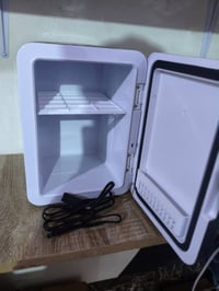 ثلاجه سيارة • تشتغل كهرباء