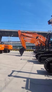 حفارة برتقالي • مـعدات بناء • مـعدات ثقيلة