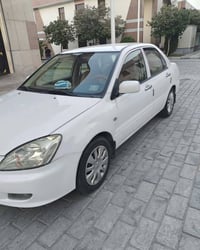 لانسر ٢٠١٠ • رقم كربلاء • محرك ١٥٠٠