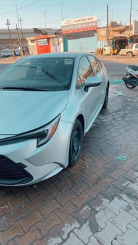 كورلا 2024 هايبرد وارد امريكي رقم بغداد بسمي ماشيه 15 الف بدون صبغ وبد...