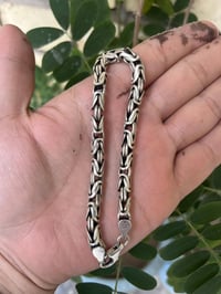 سوار فرعوني عيار 925  الوزن 34 غرام   المكان بغداد/جميلة  هاتف 0772454...