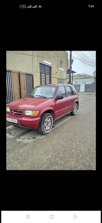 سبورتج موديل 2000 بلادية بيها صبغ بس الجنطة بسبب الهوك مالت السبير تبر...