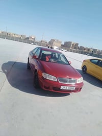 نيسان سني موديل 2002 رقم واسط دولي بأسمي مصبوغه جماليه سعرها 55 077260...