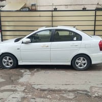 اكسنت ٢٠١٠ خليجي للبيع مكينه جديده شاشه وكامره ارضيه جلد داخلها نضيف ك...