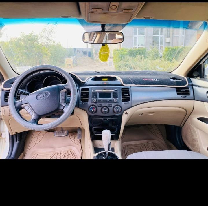 كيا اوبتيما ٢٠١٠ فول مواصفات ما عدا البصمه تحكم ستيرن ستاره خلفيه مال شركه   كير صدر محرك تدفئه تبريد مكفوله من الصبغ والضربه التبديل رقم صلاح الدين السعر ١١٨ وبيها مجال العنوان  بلد اوالضلوعيه للاتصال ***********
