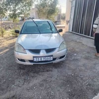 لانسر 2006رقم بغداد دولي هزه جديده  بااسمي تحويل ثاني يوم تبريد شغال ت...