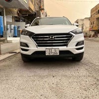 هونداي توسان خليجي موديل ٢٠٢١  رقم بغداد الماني بسمي  لون ابيض  ٤ سلند...