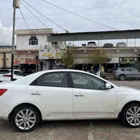 اسلام و عليكم كيا سيراتو موديل2012 رقم سنوي جديد سيارة گير عادي مكينه ...