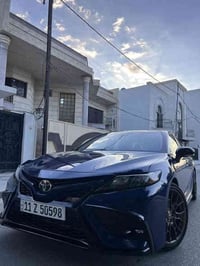 كامري 2023 SE كامله بدون نقص رقم بغداد بسمي نص فول كشن كهرباء جلد شاشه...