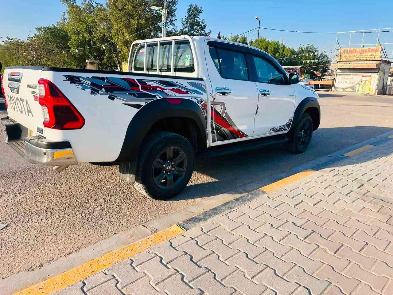 للبيع: تويوتا هايلوكس Hilux V6 موديل 2024 (الوحش الياباني) 🇯🇵🔥TRD
السلام عليكم شباب..
للبيع
السيارة غنية عن التعريف، هيبة ونظافة ومكفولة من كلشي.
المواصفات والترتيب:
 الموديل: 2024.
 المحرك: V6 (6 سلندر) عزم وقوة ما شاء الله.
 اللون: أبيض صدفي ملكي.
 العداد (الممشى): [74605]  فقط.
 الحالة: السيارة شبه زيرو، مكفولة كفالة عامة (من الصبغ، البارد، والضربة).
سنوية وهزة كله جديد والتحويل ثاني يوم.
 مواصفات، مفتاح التشغيل بصمة  -AIRBAG عدد 2
‏ABS-‏ فور ويل-‏ لايت زينون + LED -‏ كشافات زينون -بك لايت LED-‏ قبضات ابواب المنيوم  -حجم الايطار 265/65R17-مثبت سرعة -المودات والاوامر الصوتية-‏ لون المقاعد احمر -المقاعد الامامية تبريد‏-تجاوي متحركةشاشة اصلي  -كامرة -‏ حساسات امامية -حساسات خلفية -تبريد شاشة-نظام مانع تزحلق حساس اطارات -ECO -SPORT-شاحن واير ليس -اشاير بالمري والمري قابلةللطي-مخرج  Bluetooth  USB-
 السعر: [396،] يعني 3 دفاتر وستة وتسعين وبيها مجال 
 مكان السيارة: [بابل / الحلة - الكرامة 
 للاستفسار والتواصل: يرجى الاتصال على الرقم [***********-***********]
السيارة جاهزة من  الدعامية للدعامية، ، مالت شراي يدور هيبة وراحة بال. وسيارة  انظف من صور بهواي 
الله يبارك لصاحب النصيب المقسمة إله. 🌹
