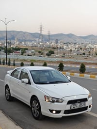 لانسر • أبيض • مكينة ١٫٦