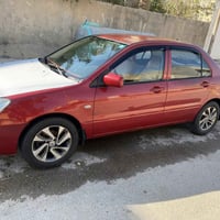 لانسر ١٠ • محرك ٢٠٠٠ • رقم ديالى