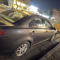 لانسر  القرش للبيع 2011 خليجي بدون حادث فقط البنيد طخه شي بسيط ع بارد ...