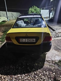 لانسر ٢٠٠٩ • محرك ٢٠٠٠ • رقم بغداد