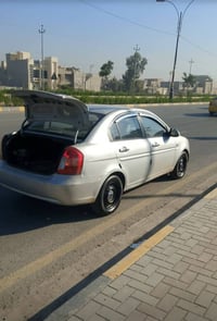 اكسن للبيع موديل 2010 وارد كوري سياره بيها قطعه تبديل باب خلفي نفس الك...