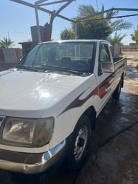 سياره نيسان ٢٠٠٢ رقم بغداد الماني للبيع السنويه لل٢٠٢٧ للتواصل 0786177...