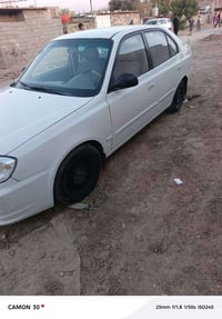 اكسنت 2004للبيع كير مكينه مكفولات بيها ضربه بالجاملغ الامامي من جهه ال...