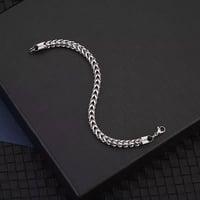 سوار رجالي • فولاذ وتيتانيوم • اسود فضي ذهبي