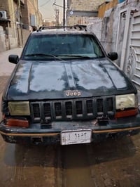 جيب شيروكي موديل 1995 محور محرك VVT ٦سلندر تخم تايرات جديد تم شده و ال...