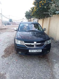 دوج جورني 7راكب رقم بغداد موديل 2009مكينه30500 07805949541