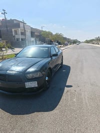 جارجر SXT موديل ٢٠١٤  وارد أمريكي مكينه ٣٦٠٠  السيارةعلمن السياره بيها...