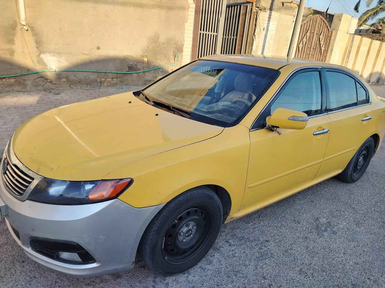 اوبتيما 2009 بيها طخات بسيطه سياره جاهزه كل نقص مابيها  المكينة حداديه 2400 أمريكي الرقم ***********
