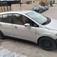 نيسان تيدا 2008 رقم بغداد مصبوغه حزام وجارده كير ومكينه بحاله ممتازه ا...