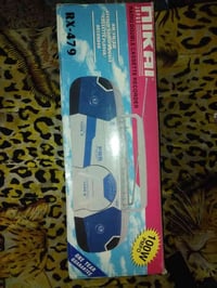 راديو مسجل بالكارتون . المسجل مايشتغل ما اعرف ليش . والراديو شغال   مك...