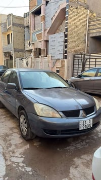 اخوان لانسر ٢٠١١ الشركة العامة سيارة كفالة من الصبغ والتبديل بيها بس ج...