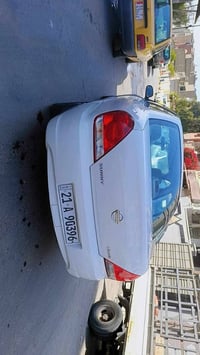 نيسان سني ٢٠١٠ رقم سليمانية الجديد باسمي السيارة كفالة عامة من الصبغ ب...