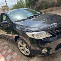 كورولا ٢٠١٠ • اسود • كارت بنزين كركوك