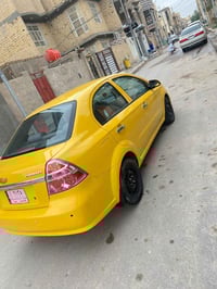 سياره افيو 2009السياره جاهزه اي نقص ما بيه مكفوله ضربه وكصه ونقل حداده...