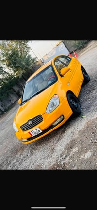 اكسنت ٢٠١٠  رقم بغداد باسمي  سنويه وهزه جديده  وارد كوري مكفوله من ضرب...