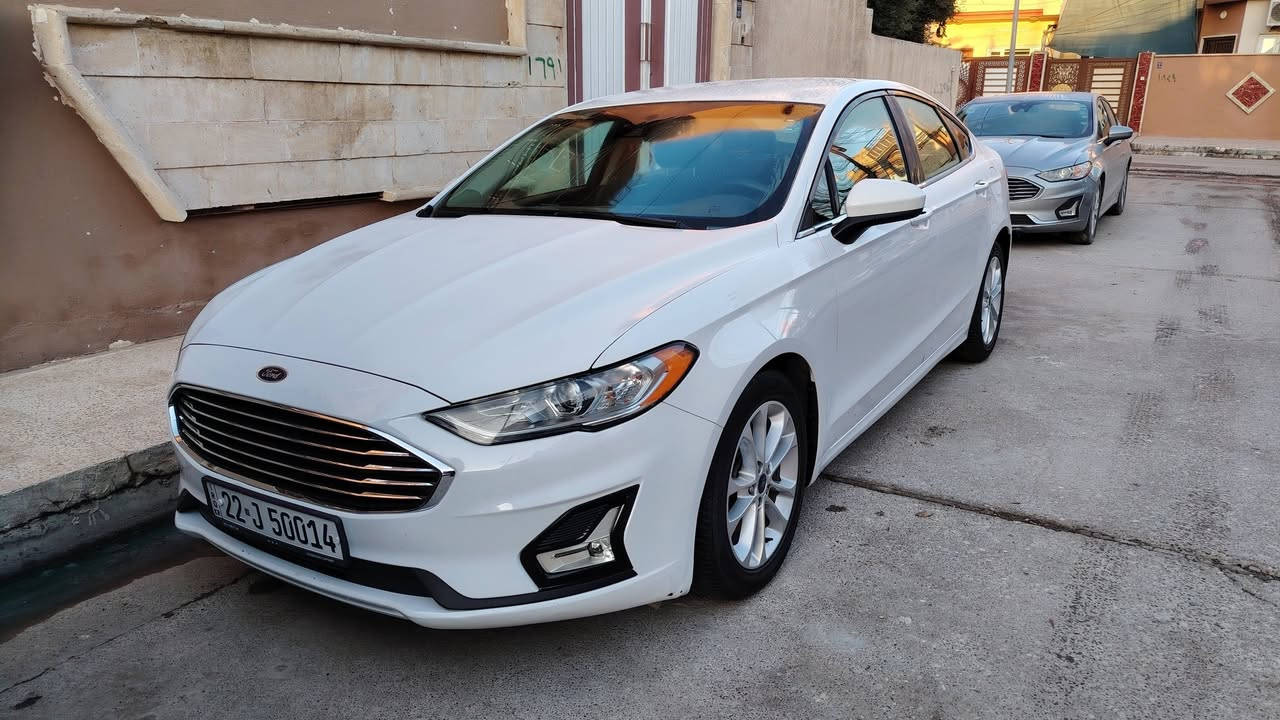 فورد فيوجن 2019  Se فول مواصفات
1500 سي سي توربو
اللون أبيض ثلجي ( لا صدفي ولا اوف وايت) 
تك اكسل المرغوب
لايتات زينون أصلي أبو الضمان
لايتات اوتو و ذكية 
بلوجكتر لد led
داخل أسود
رادار جانبي و خطوط الشارع 

٣ شاشات
شاشة sync 3.4 محدثة آخر اصدار مع برمجة ثيمات و تشغيل فيديوات Mp4
حساسات خلفية
كشن السايق و السكن كهرباء  ١٢ وضعية

مري تعتيم  
ويل 18 نظيف حيل
تبريد لمس  
ماشية 113 الف كيلو متر
كير محرك تبريد كلشي بشرط الفحص والسونار

ضررها بسيط جداً:  بيها صبغ شوية بالچنطة (بالصندوگ) و شبر  يم اللايت الخلفي (بدون دواخل بدون ايرباك). 

👈  سعرها 140 ورقة وبيها مجال  👉

***********
مكان السيارة موصل ـ الساحل الايسر

💥 ملاحظة: السيارة جديدة بمعنى الكلمة. 💥

وجاهزة من كل النواحي شرط ما بيها أي نقص💯
دهون السيارة من شركة موتل الشهيرة. 
دهن گير تم تبديله مرتين (حسب الكتالوك) من شركة موتل.
