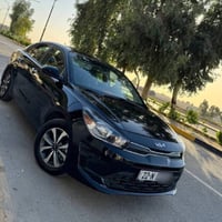 كيا ريو 2023 فئه LXS رقم اربيل  وارد امريكي ماشيه 31 الف ميل فول ماعدا...