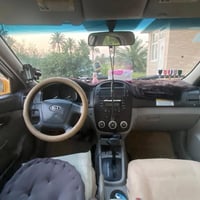كيا سبكترا ٢٠٠٩ لون اصفر رقم بابل  حداديه وره وكدام جديده  مكينه وكير ...