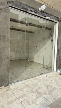 أعمال واجهات زجاج 10ملم 07716619996