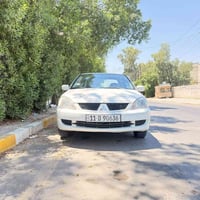 لانسر 2011 للبيع مكينة 1500 4 سلندر كير اوتماتيك رقم بغداد الجديد جاهز...