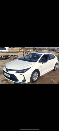 كورلا هايبرد 2024 سياره ماشيه 9 الاف سياره مكفولة  رقم بغداد باسمي  سع...