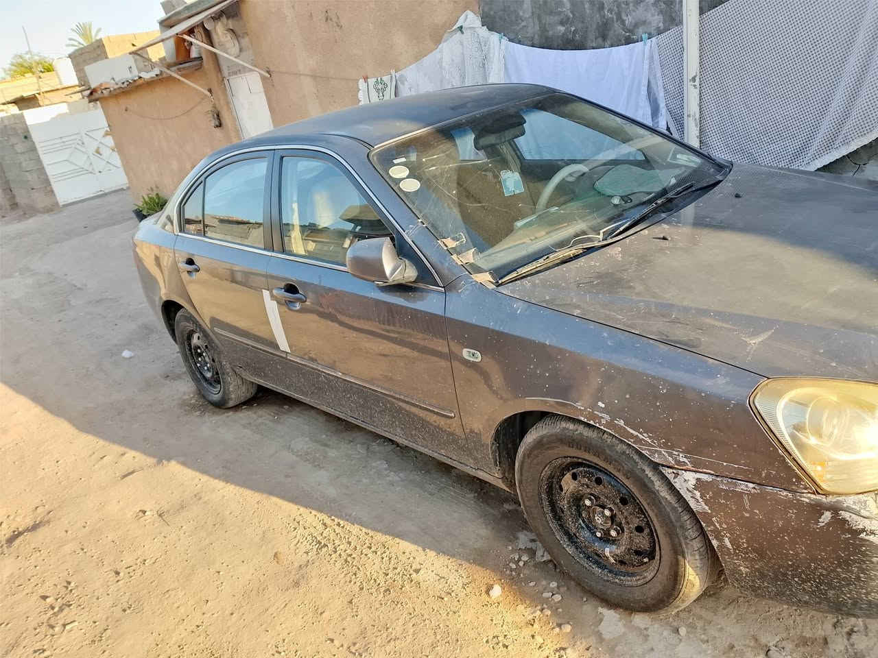 كيا اوبتيما 2008 وارد خليجي سياره خير من الله كير مكينه 2000 تبريد كله جاهز مناقصه اي شي  تخم تأير و باتري جديد بس بيه الباب خلف الصدر مبدل والباب خلف السائق مصلح نفسه وبيه جراد قماره وبنيد المكان سياره بغداد الزعفرانية السعر 95 بيه مجال رقم الهاتف ***********
