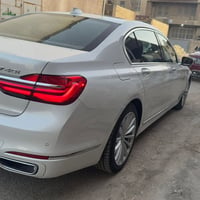 bmw G12 740 2018 وارد امريكي لون ابيض داخل قهوائي سقف بانورما  حساس ام...