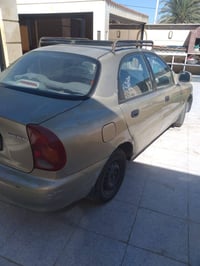 دايو لانوس موديل ٢٠٠٠ مكفولا من ضربه وحداديه ومحرك وكير عادي السعر ٣٠ ...