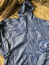 قميص مطري • توصيل