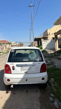 QQ شيري  2013  رقم بغداد مشروع وطني باسمي السياره ضررها شبر جاملغ خلفي...